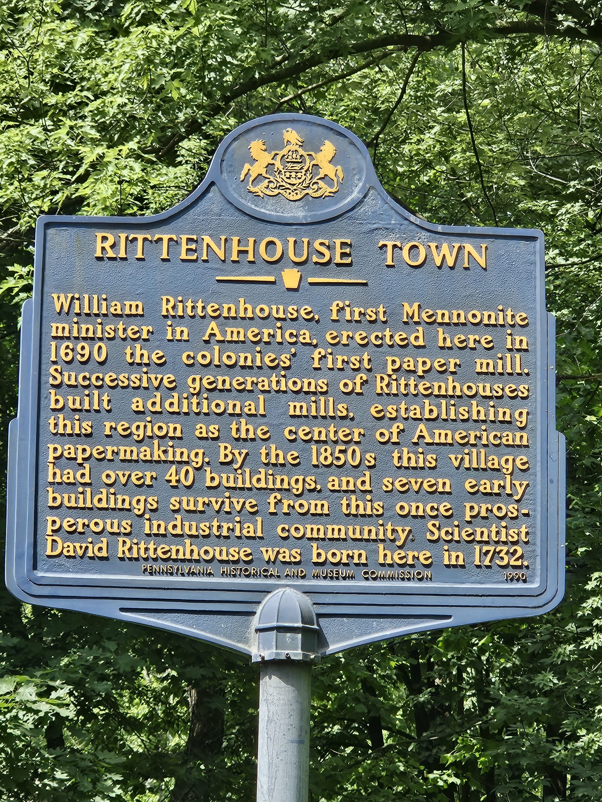 A Sign Mounted on a Pole, Displaying Information or Directions in a Public Space.